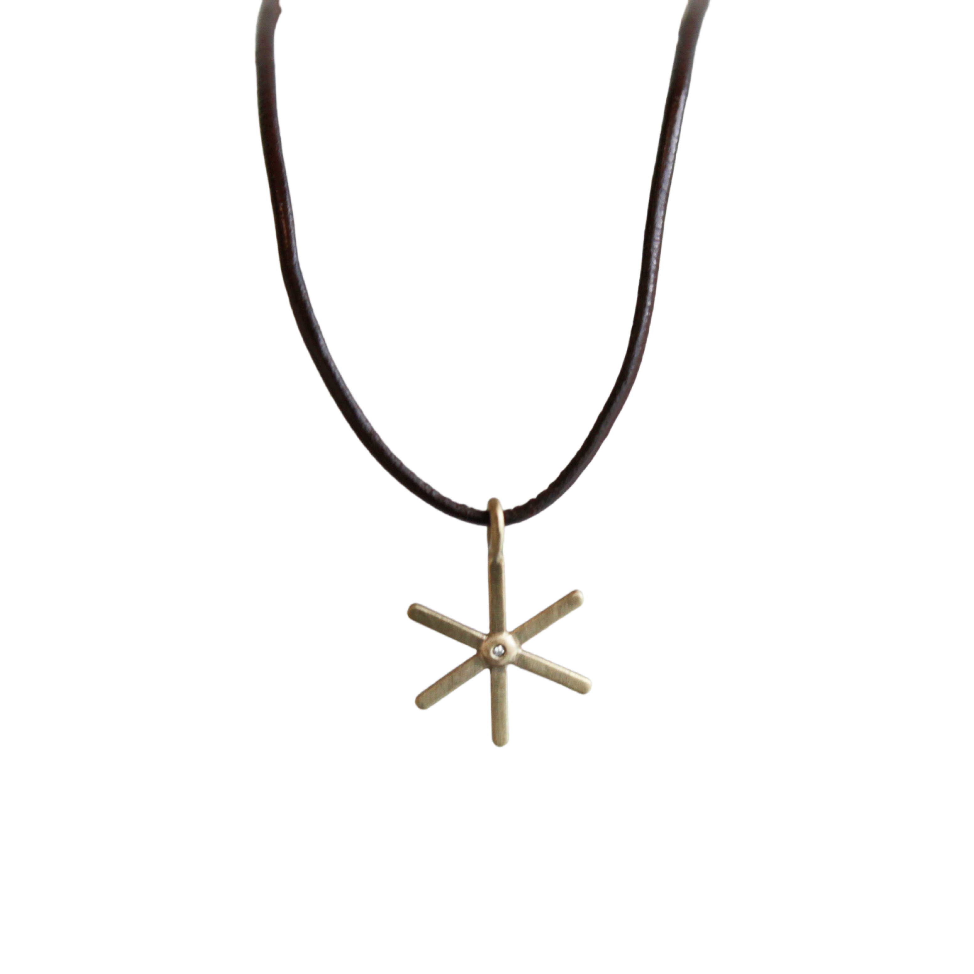 yellow gold and diamond starburst necklace on 16" brown leather