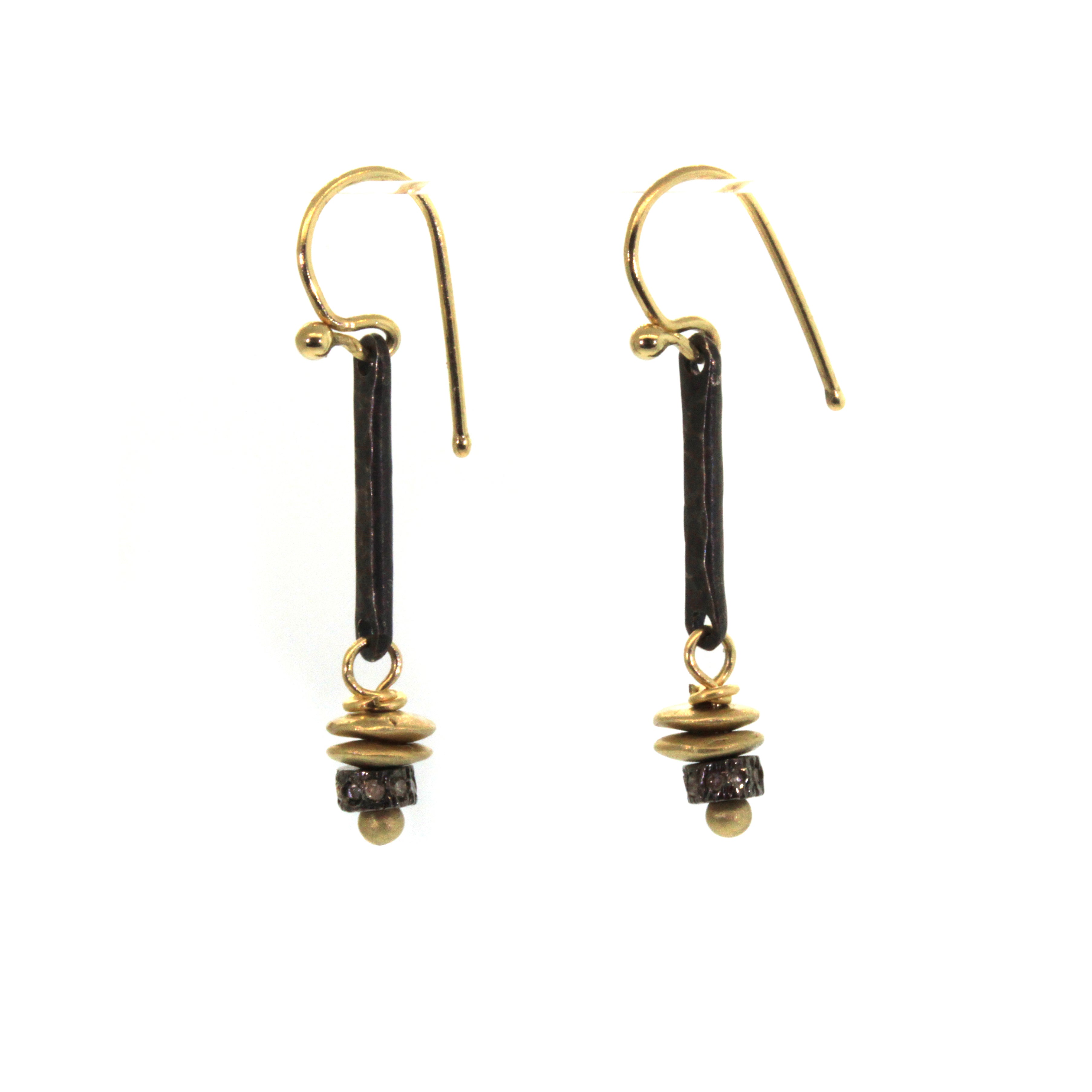 These Bohemian Dangle Earrings are handcrafted at Studio 703 + RLD by Rebecca Lankford. They feature an oxidized sterling silver bar with 2 yellow gold discs and a diamond roundel bead dangling from it. 