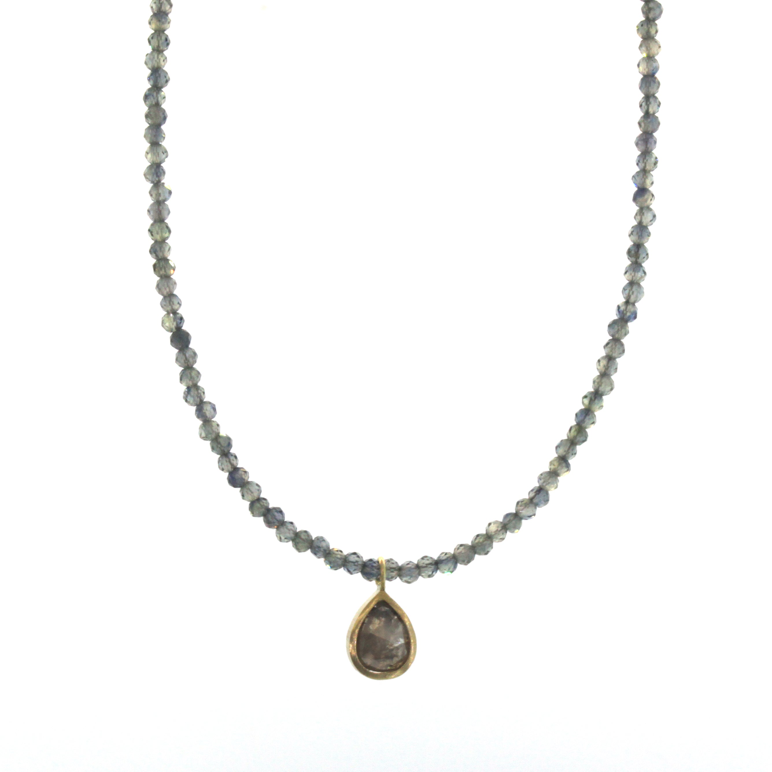 This Blue Sapphire & Raw Diamond Necklace was hand made at Rebecca Lankford Designs in Houston, Texas. Every diamond is hand picked for each individual necklace making them all one-of-a-kind. 