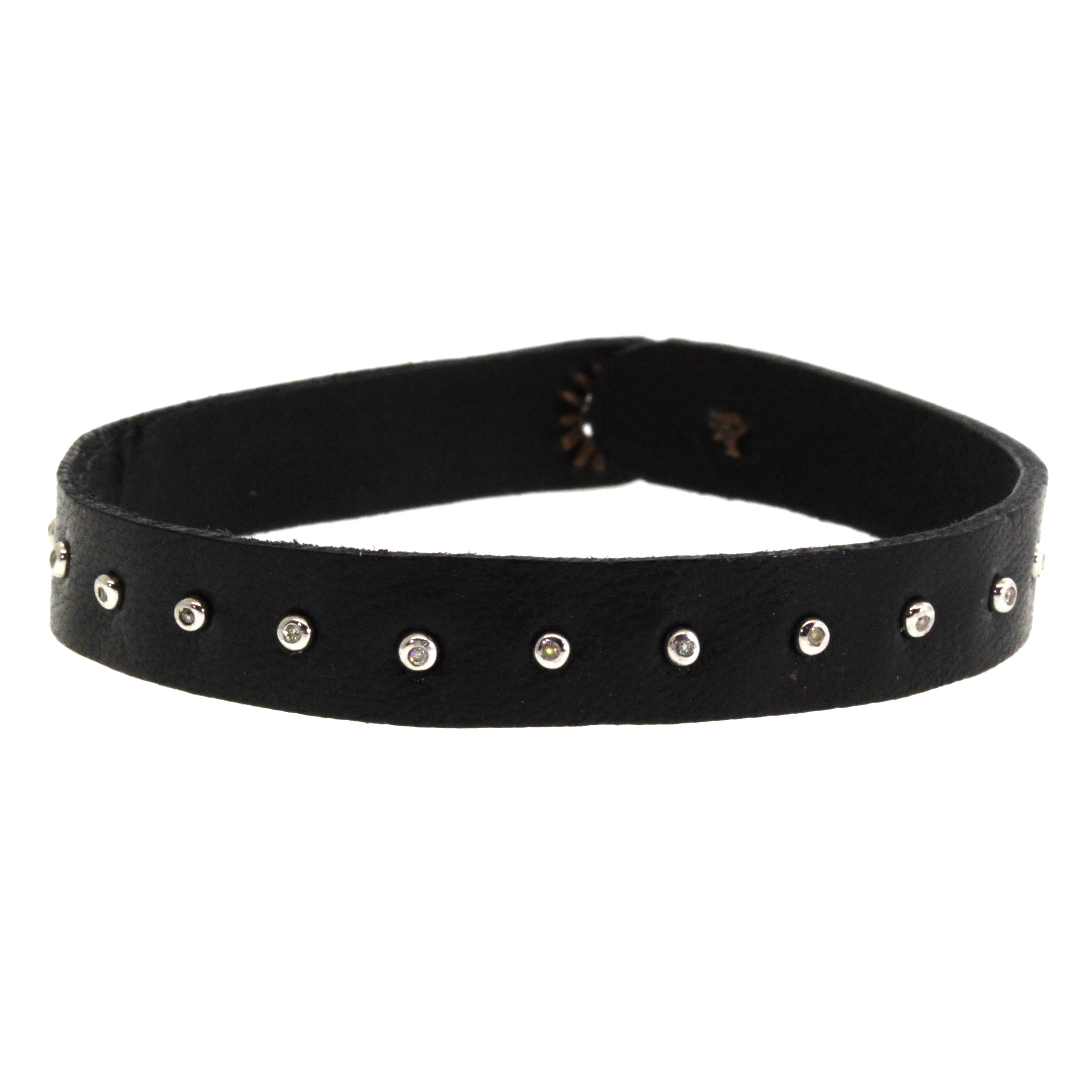 This Diamond Studded Leather Bracelet features 15 shimmering diamonds studded into hand cut and dyed black leather. It was expertly crafted at Rebecca Lankford Designs in Houston, Texas.