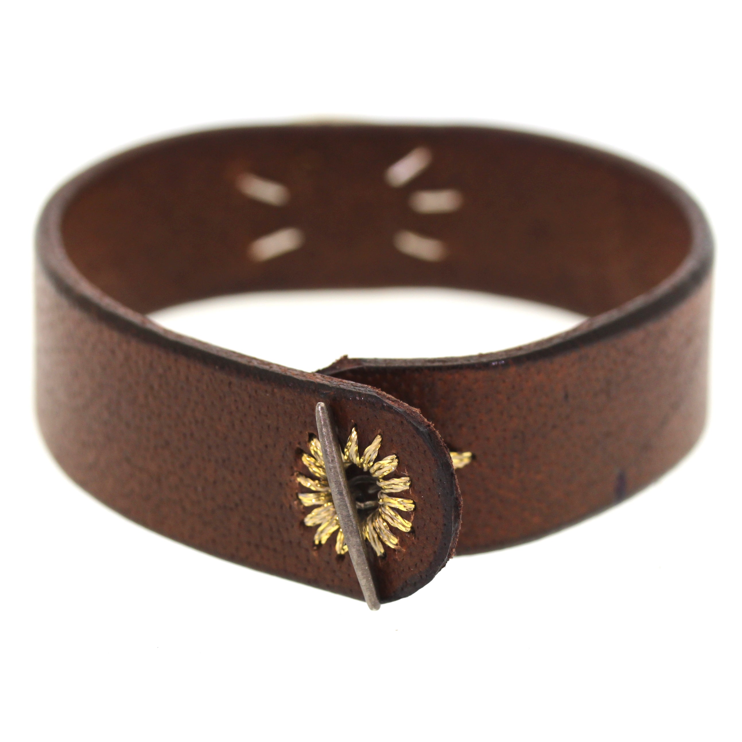 This Rutilated Quartz Leather Bracelet was handcrafted at Rebecca Lankford Designs in Houston Heights. It features a rutilated quartz bezel set in yellow gold on chocolate brown buffalo leather with an oxidized sterling silver closure and a golden thread hand stitched hole. 
