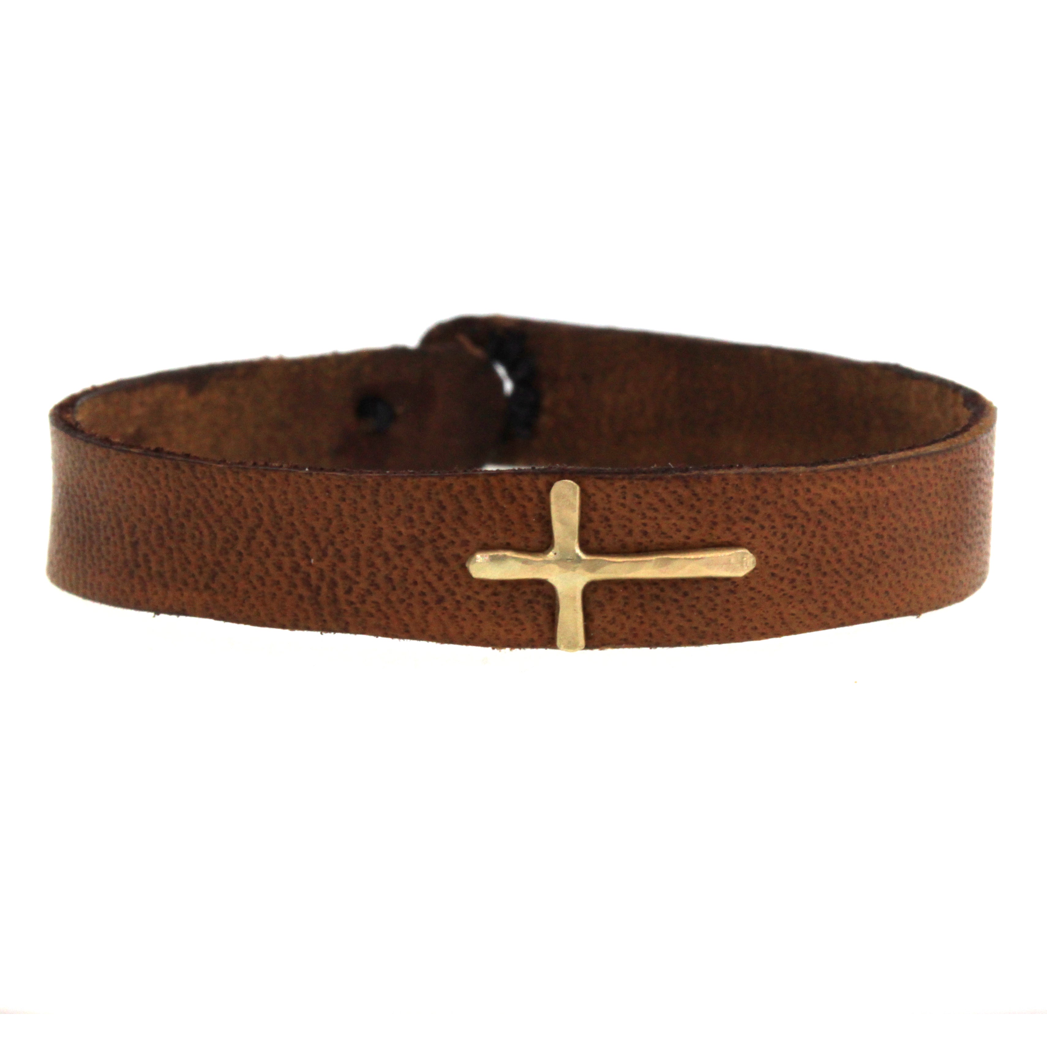 Hand cut and dyed, this gold cross leather bracelet is made to order at Rebecca Lankford Designs in Houston Heights.