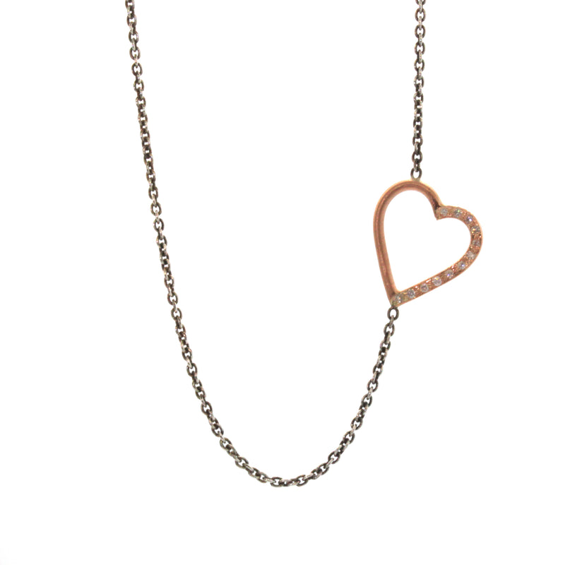 Sideways Heart necklace with diamonds pave set into half of the heart soldered into an oxidized sterling silver chain. This necklace was expertly handcrafted at Rebecca Lankford Designs in Houston Texas.