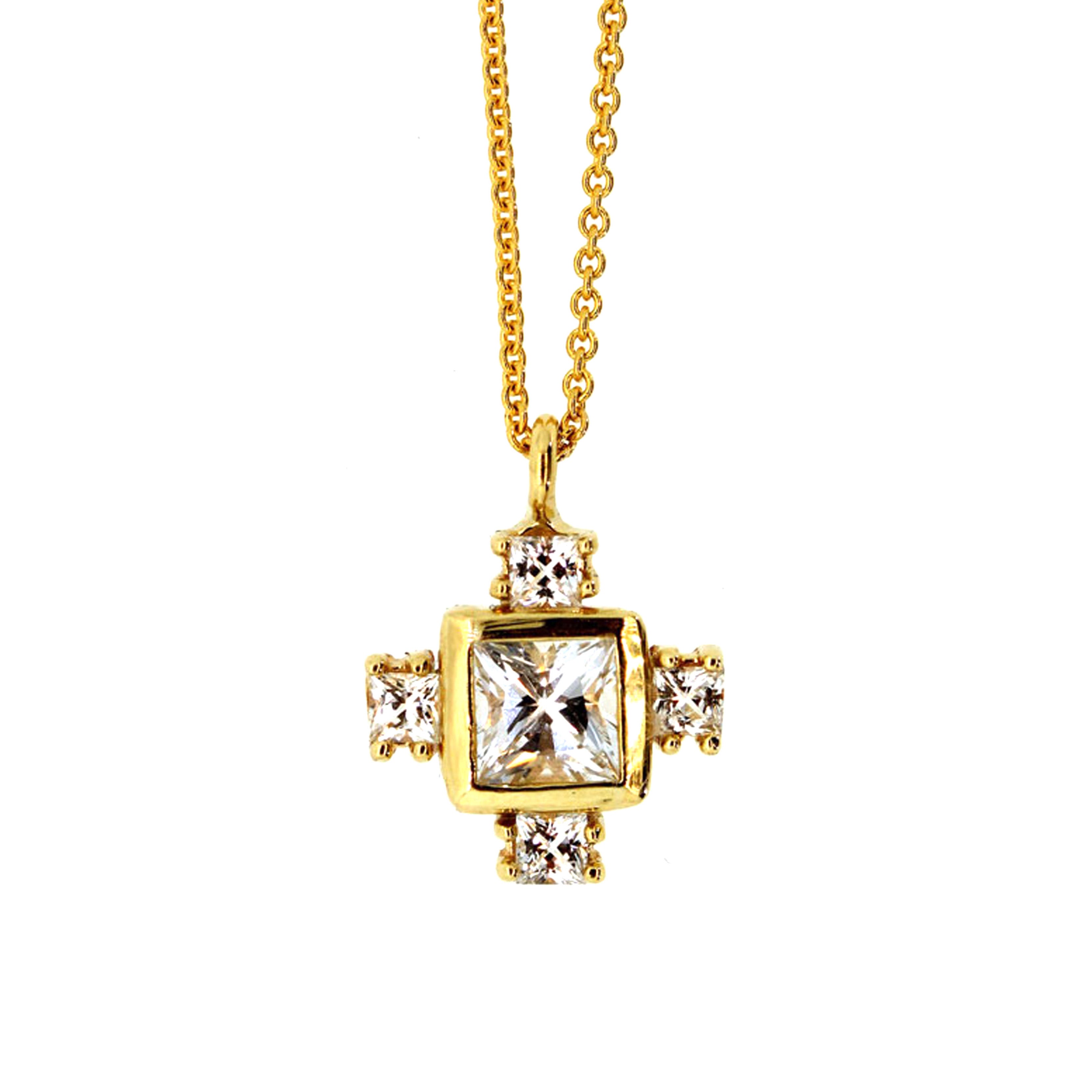 This Byzantine Cross Necklace consists of four small white sapphires prong set soldered around a larger white sapphire bezel set and dangling from a yellow gold chain. Each stone is hand picked and necklace made to order at Rebecca Lankford Designs in Houston, Texas.
